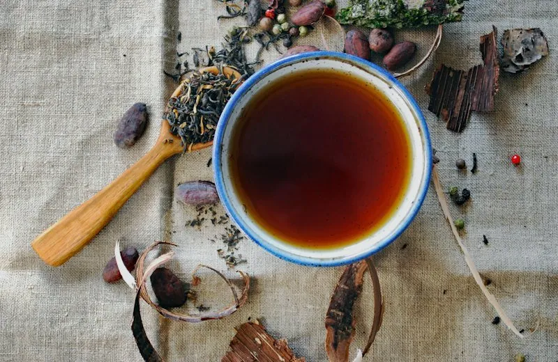 A cup of herbal tea on a linen cloth