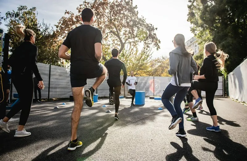 Women running outdoors on a sunny street