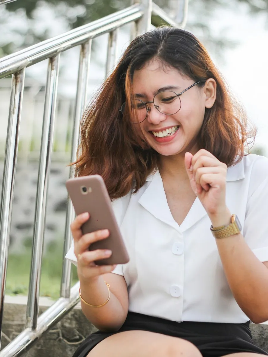 Smiling woman looking at her phone